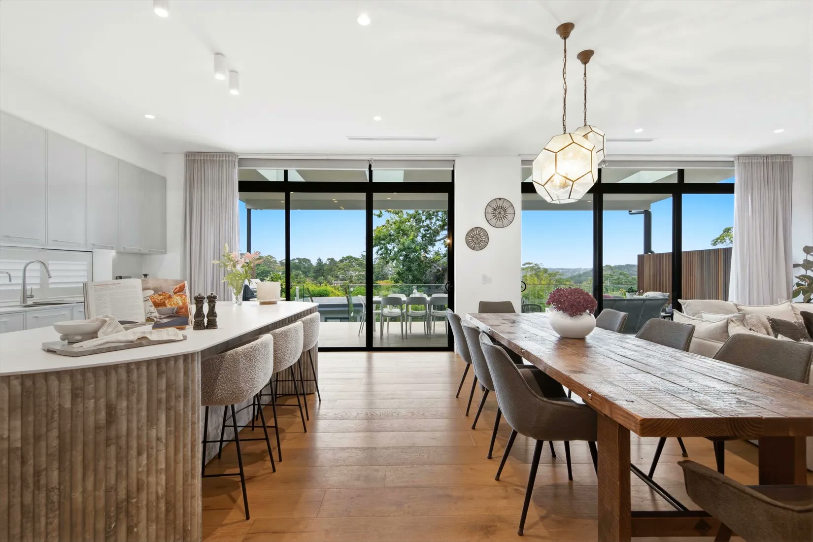Kitchen island and dining beyond