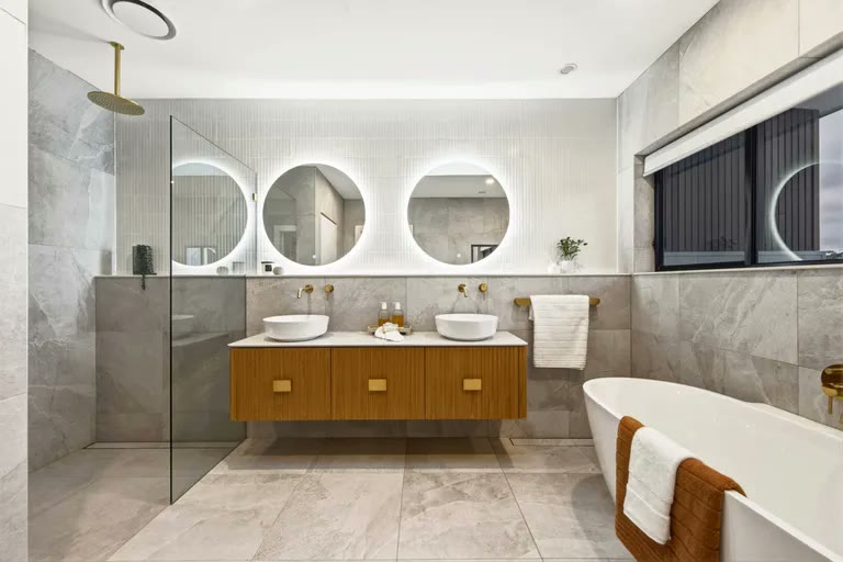 Main bathroom with twin basins and freestanding bath